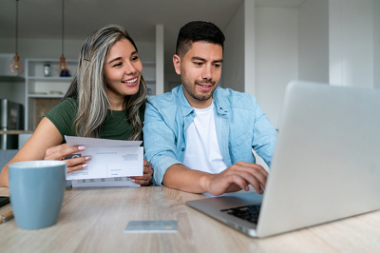 Couple checking account using computer